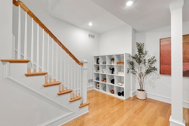 42 Coolidge St Unit 42, Brookline, MA 02446 - stairs featuring wood finished floors, recessed lighting, and baseboards