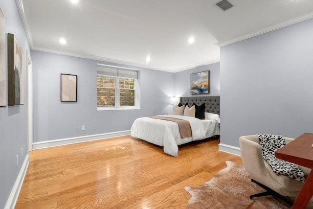 42 Coolidge St Unit 42, Brookline, MA 02446 - bedroom with ornamental molding, wood finished floors, recessed lighting, and baseboards