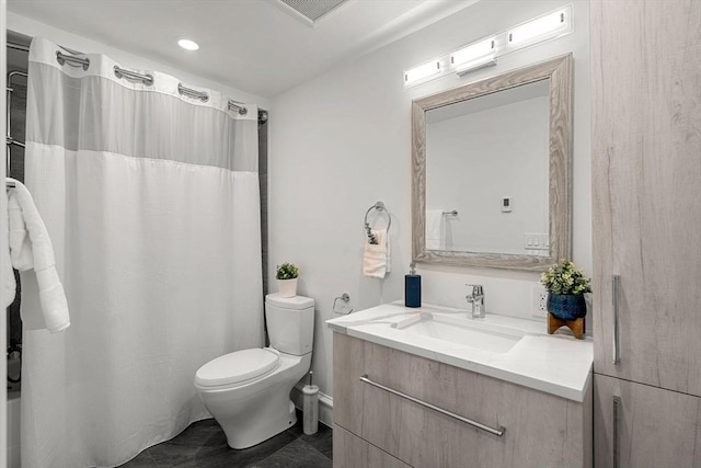 42 Coolidge St Unit 42, Brookline, MA 02446 - bathroom featuring vanity, toilet, and shower / bath combo with shower curtain