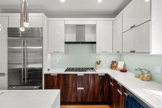 42 Coolidge St Unit 42, Brookline, MA 02446 - kitchen featuring stainless steel appliances, modern cabinets, wall chimney range hood, white cabinets, and recessed lighting