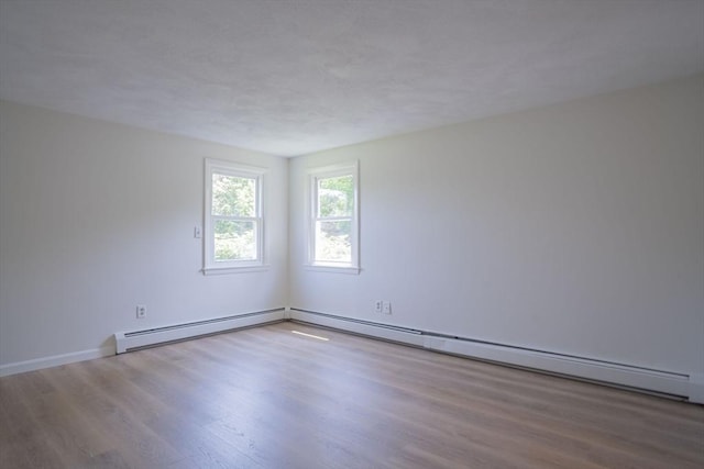 6 Marshall Rd, Beverly, MA 01915 - unfurnished room with wood finished floors and a baseboard radiator