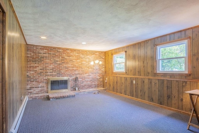 6 Marshall Rd, Beverly, MA 01915 - unfurnished living room with a textured ceiling, wood walls, a fireplace, carpet floors, and brick wall