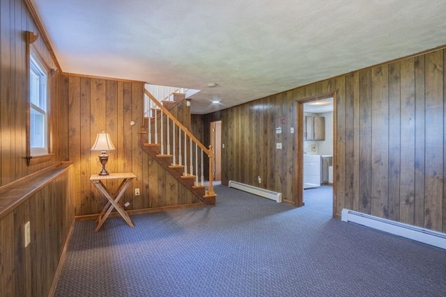 6 Marshall Rd, Beverly, MA 01915 - basement with a baseboard heating unit, stairway, washer / dryer, wood walls, and carpet