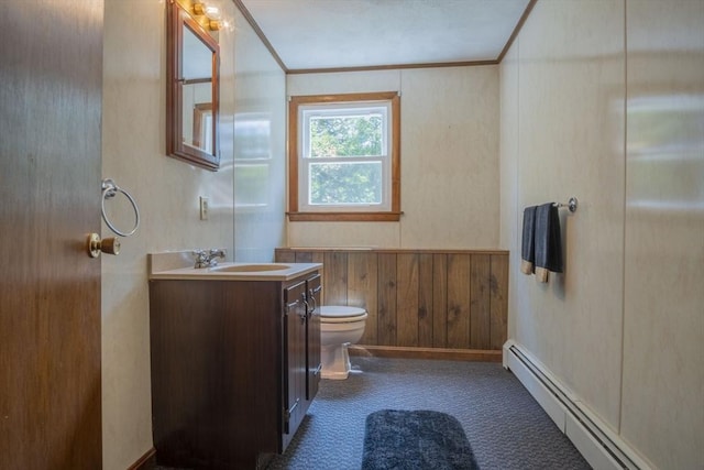 6 Marshall Rd, Beverly, MA 01915 - bathroom with a baseboard heating unit, ornamental molding, vanity, wood walls, and wainscoting