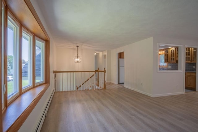 6 Marshall Rd, Beverly, MA 01915 - empty room with light wood-style flooring and plenty of natural light