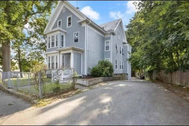 view of home's exterior with fence