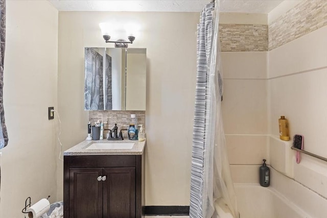 full bath featuring vanity and shower / bath combo with shower curtain