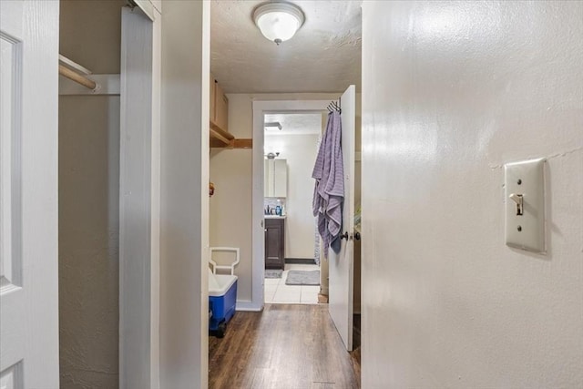 hallway with dark wood-style flooring