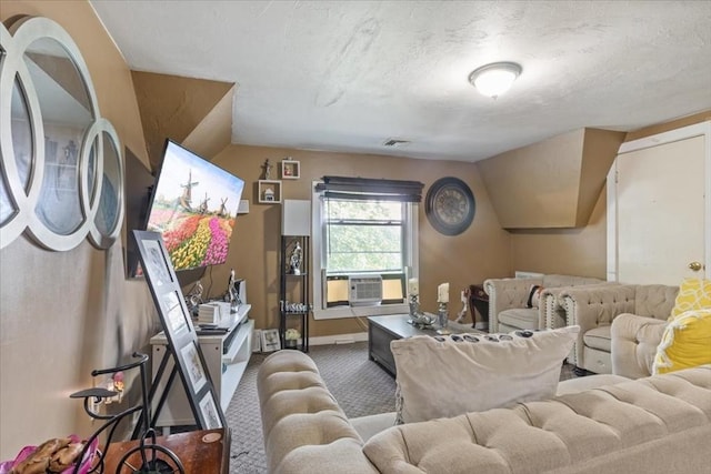 living room featuring visible vents, baseboards, cooling unit, a textured ceiling, and carpet flooring