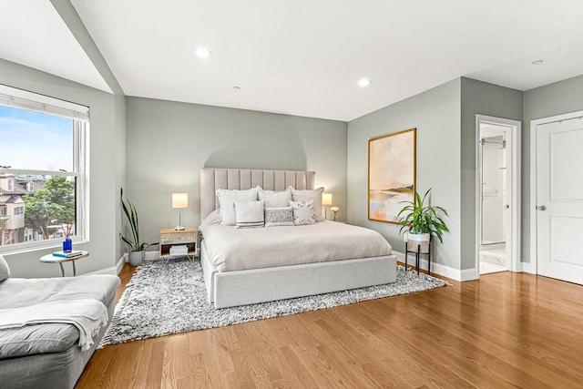 280 W 5th St Unit 101, Boston, MA 02127 - bedroom featuring wood finished floors, recessed lighting, and connected bathroom