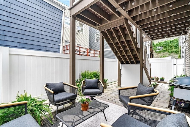 280 W 5th St Unit 101, Boston, MA 02127 - fenced backyard with stairs, a patio area, and area for grilling