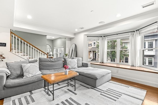 280 W 5th St Unit 101, Boston, MA 02127 - living area featuring wood finished floors, stairs, crown molding, and recessed lighting