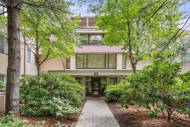 228 Allandale Rd Unit 1A, Boston, MA 02467 - view of front of house with stucco siding