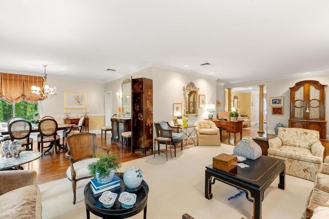 228 Allandale Rd Unit 1A, Boston, MA 02467 - living room with a chandelier, decorative columns, wood finished floors, and crown molding