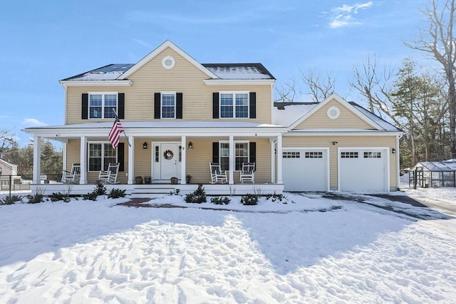 view of front facade with a garage and covered porch