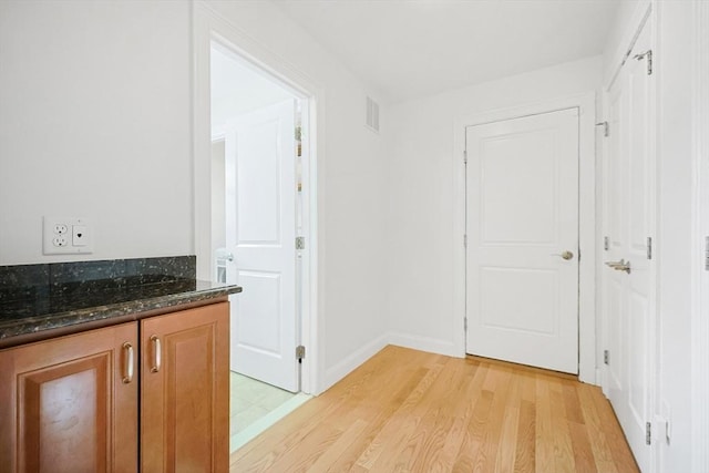 hallway featuring light wood-type flooring