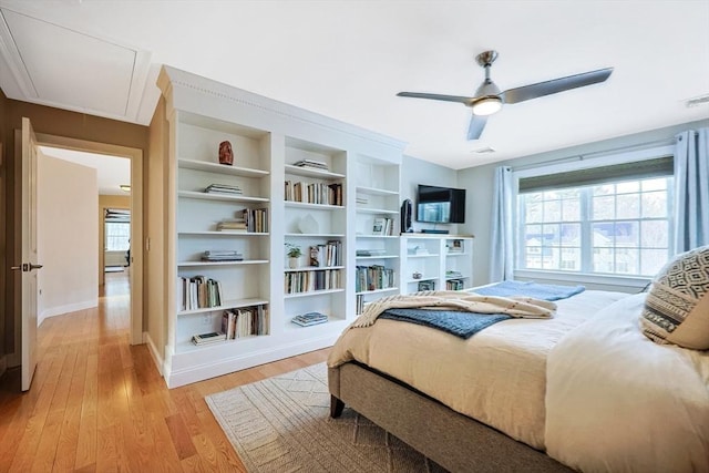 bedroom featuring light hardwood / wood-style floors and ceiling fan