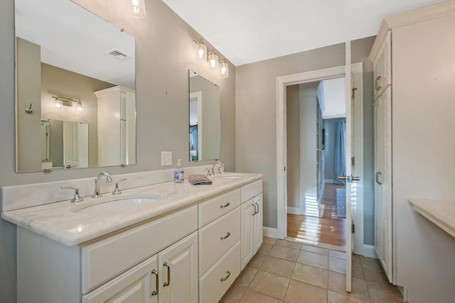 bathroom with vanity and tile patterned floors