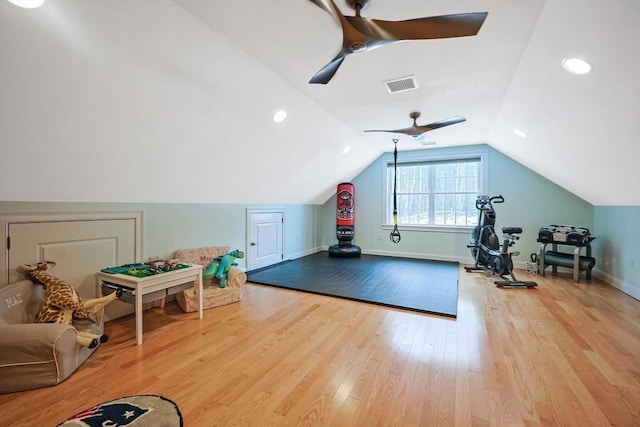 workout room with lofted ceiling, light hardwood / wood-style floors, and ceiling fan