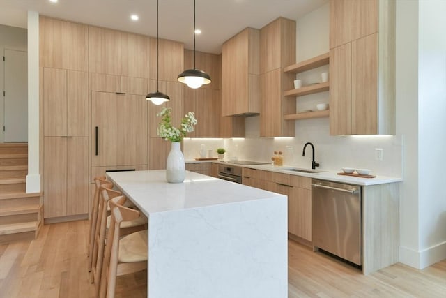 21 Eastman Rd Unit 0, Somerville, MA 02143 - kitchen with stainless steel appliances, modern cabinets, open shelves, a kitchen island, and recessed lighting