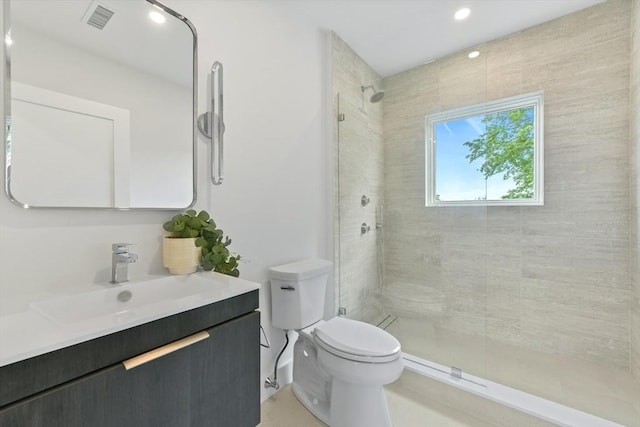 21 Eastman Rd Unit 0, Somerville, MA 02143 - bathroom featuring vanity, tiled shower, and recessed lighting