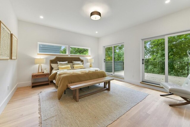21 Eastman Rd Unit 0, Somerville, MA 02143 - bedroom with access to outside, light wood-style flooring, and recessed lighting