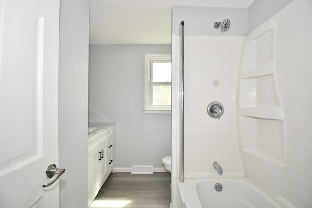 full bath with visible vents, wood finished floors, vanity, baseboards, and toilet