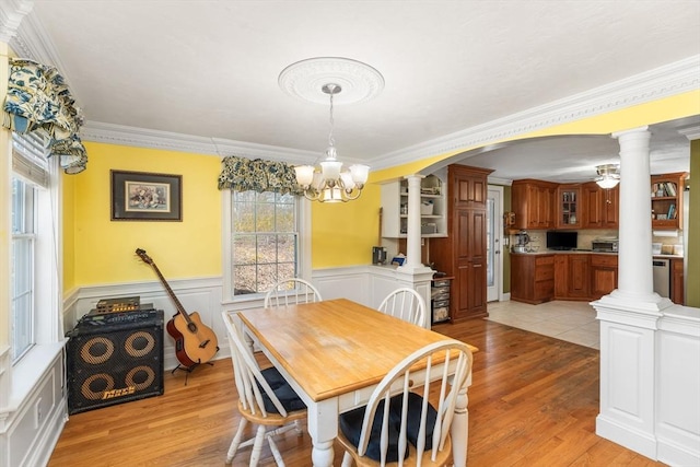 86 Whitney, Northborough, MA 01532 - dining space with ornate columns, ornamental molding, light wood-style floors, a chandelier, and wainscoting