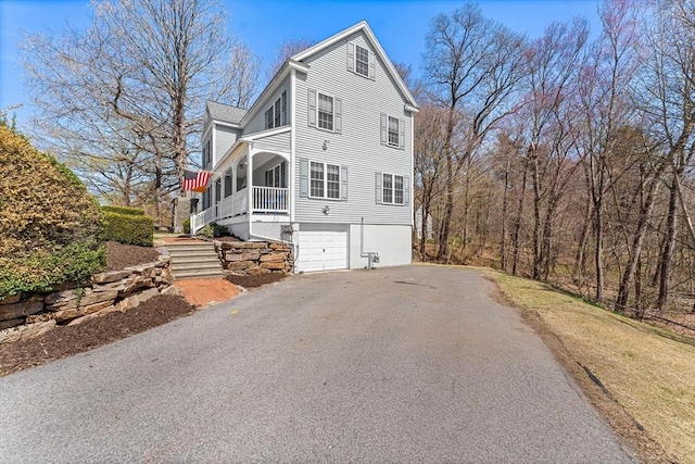 86 Whitney, Northborough, MA 01532 - view of front of home featuring driveway, an attached garage, and stairs