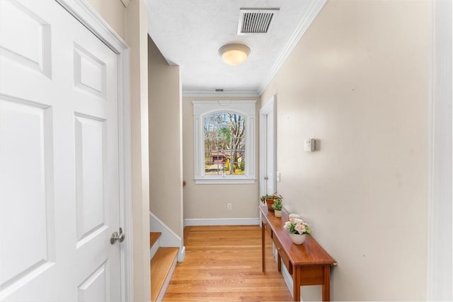86 Whitney, Northborough, MA 01532 - doorway to outside with light wood-type flooring, ornamental molding, and baseboards