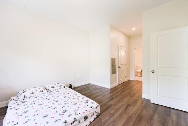 bedroom featuring dark wood-type flooring, baseboards, and recessed lighting