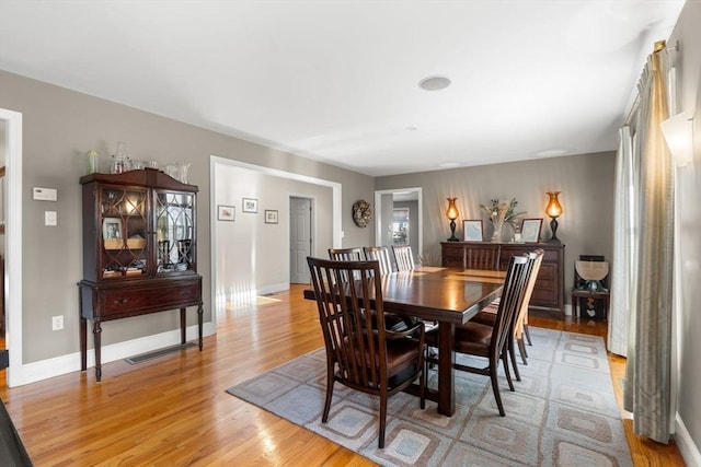 dining space featuring light hardwood / wood-style floors