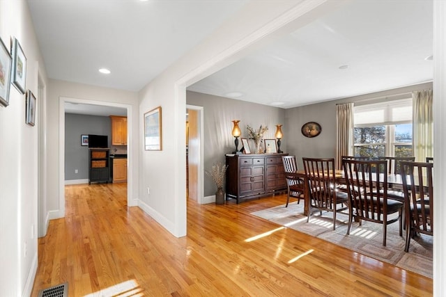 dining area with light hardwood / wood-style flooring