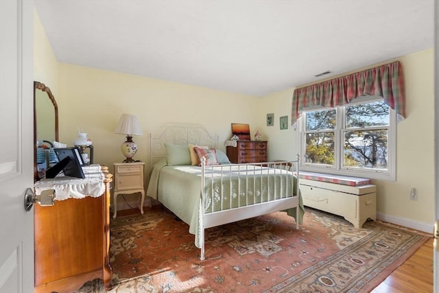 bedroom with wood-type flooring