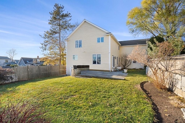 back of property featuring a patio and a lawn