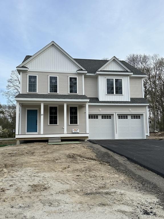 view of front of home with a garage, board and batten siding, roof with shingles, and aphalt driveway