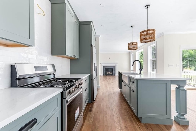 20 Sperry Ln, North Attleboro, MA 02760 - kitchen with stainless steel appliances, a sink, gray cabinetry, light countertops, and ornamental molding