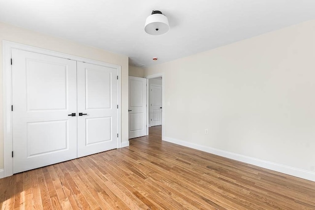 20 Sperry Ln, North Attleboro, MA 02760 - unfurnished bedroom featuring baseboards, light wood finished floors, and a closet