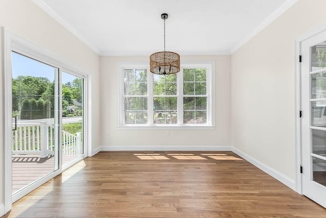 20 Sperry Ln, North Attleboro, MA 02760 - unfurnished dining area with a chandelier, plenty of natural light, light wood finished floors, baseboards, and ornamental molding