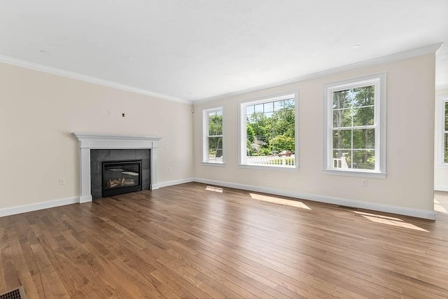 20 Sperry Ln, North Attleboro, MA 02760 - unfurnished living room featuring hardwood / wood-style floors, plenty of natural light, crown molding, and a tiled fireplace