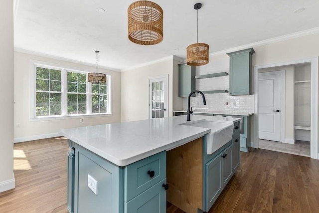 20 Sperry Ln, North Attleboro, MA 02760 - kitchen featuring a sink, decorative backsplash, ornamental molding, wood finished floors, and baseboards