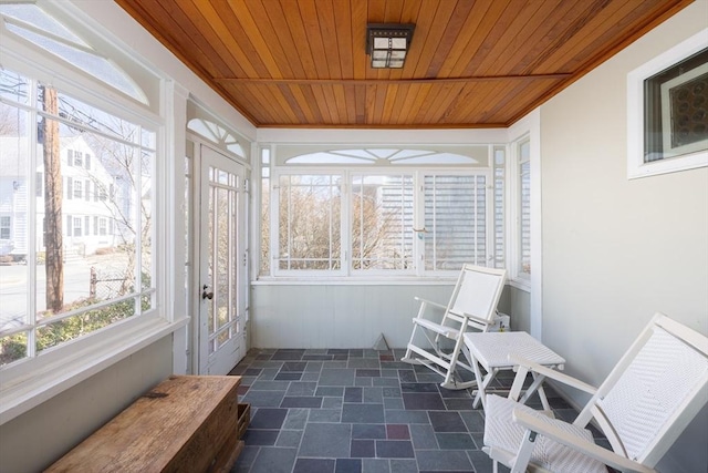 sunroom / solarium featuring wood ceiling