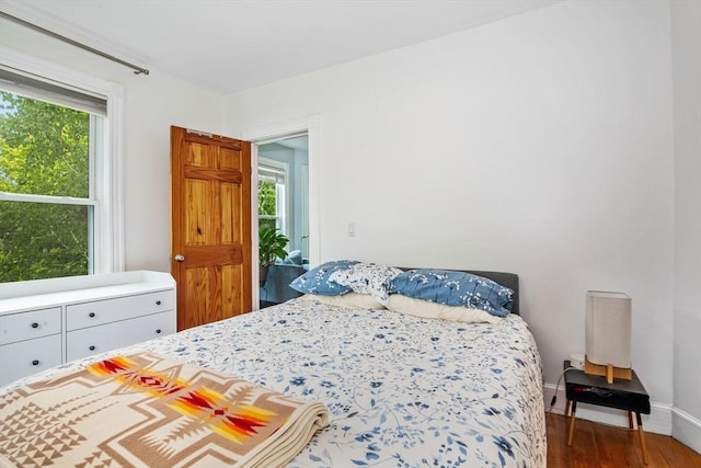 4 Marlou Unit 3, Boston, MA 02130 - bedroom with multiple windows, wood finished floors, and baseboards