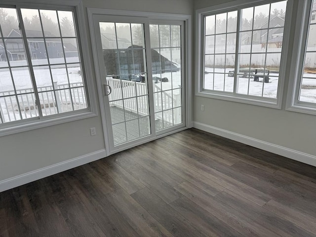 empty room with baseboards and a healthy amount of sunlight