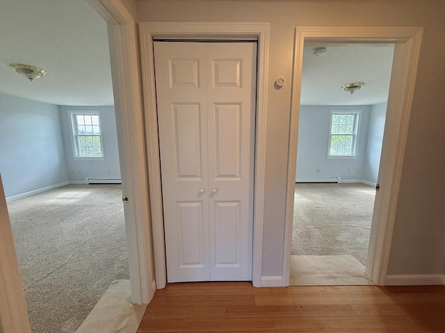 56 Center St Unit 2-3, Dennis, MA 02639 - hall with light colored carpet, baseboards, and a baseboard radiator