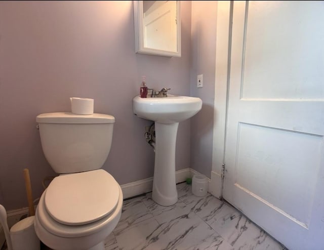 29 Neptune Ave, West Springfield, MA 01089 - half bath featuring marble finish flooring, toilet, and baseboards