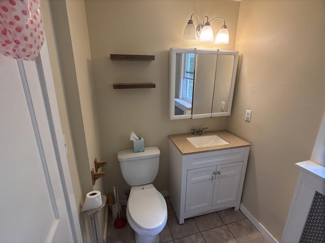 29 Neptune Ave, West Springfield, MA 01089 - bathroom featuring vanity, tile patterned flooring, toilet, and baseboards