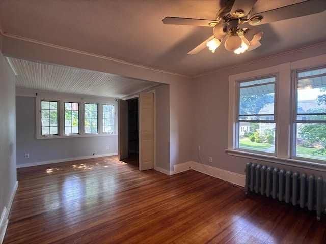 29 Neptune Ave, West Springfield, MA 01089 - spare room with radiator, dark wood finished floors, baseboards, ornamental molding, and a ceiling fan