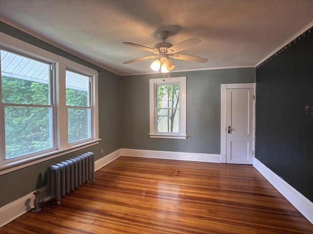 29 Neptune Ave, West Springfield, MA 01089 - unfurnished room with plenty of natural light, radiator heating unit, wood finished floors, crown molding, and baseboards