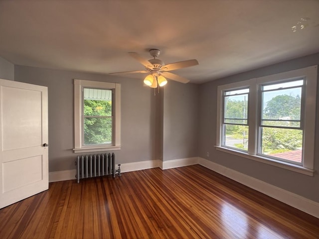29 Neptune Ave, West Springfield, MA 01089 - empty room featuring radiator, baseboards, wood finished floors, and ceiling fan